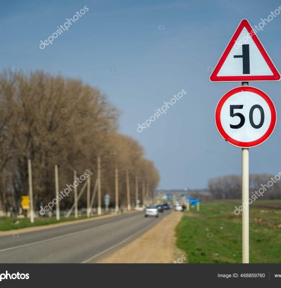 Road signs speed limit 50 km per hour. The road turns left raw footage